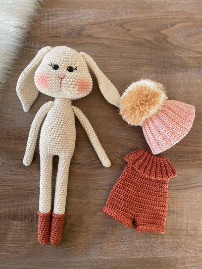 Handmade crocheted Hatted Bunny Rabbit Toy with a cozy hat and outfit, customizable with a name on a leather label. Perfect for nursery decor and as a unique easter or baby shower gift.