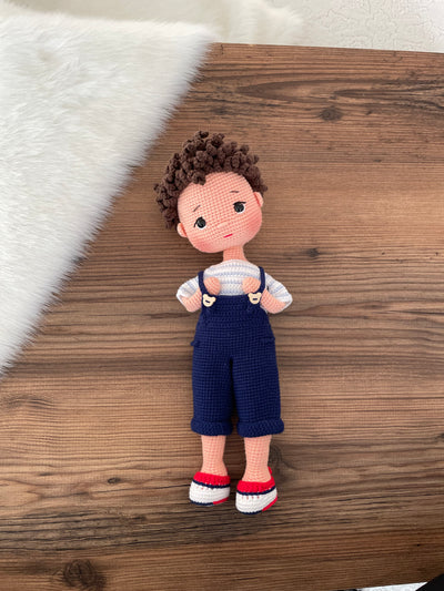 Handmade crocheted overall boy doll, crafted with amigurumi technique using 100% cotton yarn, customized with a name on a leather label, perfect gift.