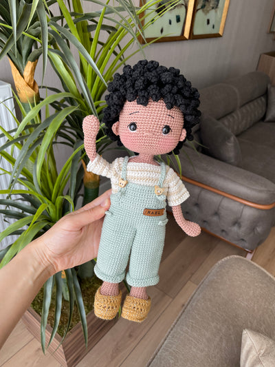 Handmade crocheted overall boy doll, crafted with amigurumi technique using 100% cotton yarn, customized with a name on a leather label, perfect gift.