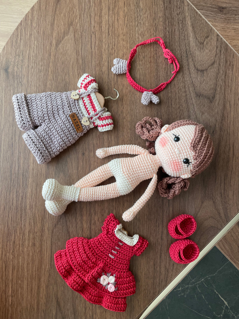 Handmade crochet Forest Girl Doll with two interchangeable dresses and matching accessories. This amigurumi doll is customizable with a name on a leather label, perfect for personalized gifts.