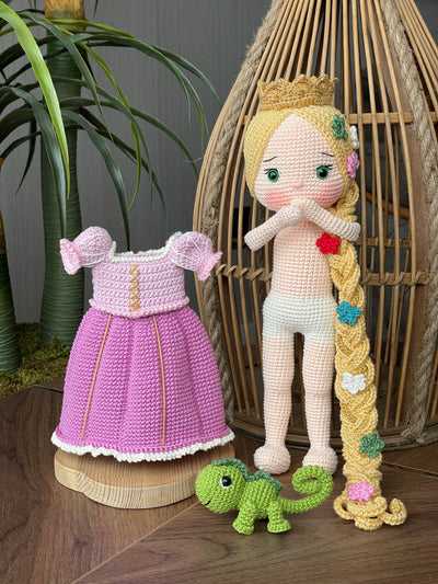 Handmade crocheted Rapunzel and Flynn Rider Dolls with Pascal, featuring intricate details such as Rapunzel's long braided hair and floral accents. These are customizable with a name on a leather label, perfect as a fairy tale-themed gift or decor.