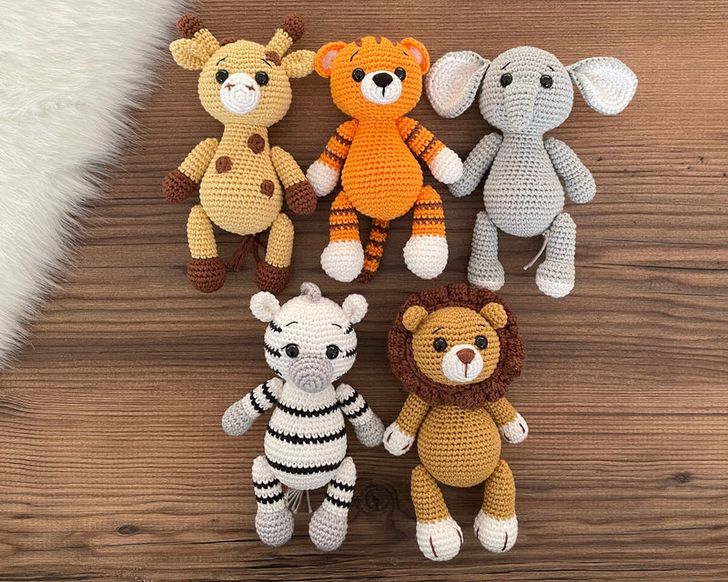 Handmade Safari Animals set including giraffe, tiger, elephant, zebra, and lion, all made with 100% cotton yarn, perfect for unique toddler gifts and imaginative play.