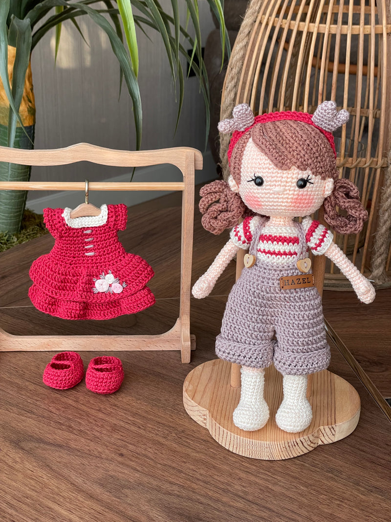 Handmade crochet Forest Girl Doll with two interchangeable dresses and matching accessories. This amigurumi doll is customizable with a name on a leather label, perfect for personalized gifts.