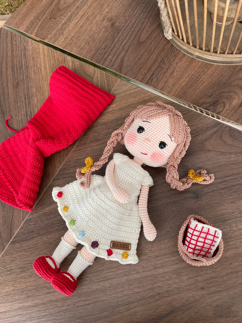 Handmade crochet Little Red Riding Hood doll, inspired by the classic fairytale, featuring a red cape, basket, and customizable name on a leather label. Perfect for kids and collectors.