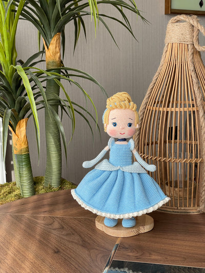 Handmade Cinderella Doll, crocheted using amigurumi technique with a blue dress, blonde hair, and custom name on a leather label, perfect for princess lovers and gifts.