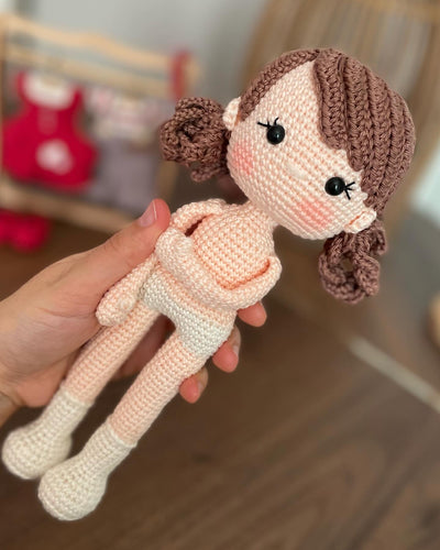 Handmade crochet Forest Girl Doll with two interchangeable dresses and matching accessories. This amigurumi doll is customizable with a name on a leather label, perfect for personalized gifts.