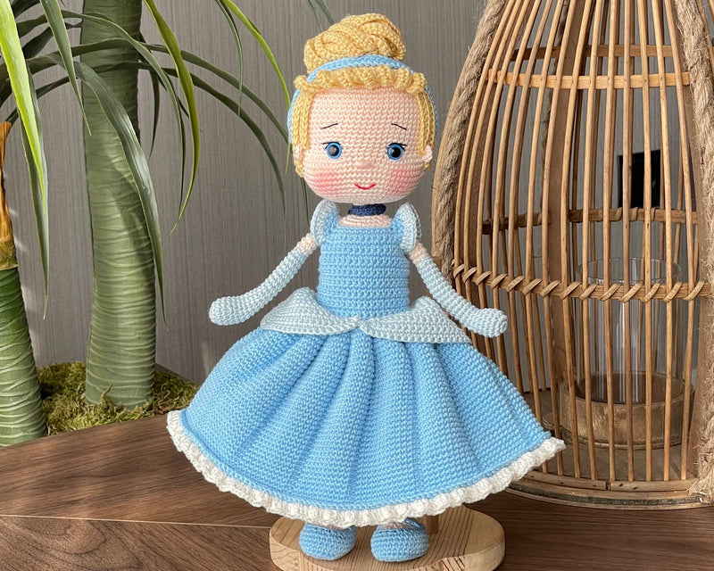 Handmade Cinderella Doll, crocheted using amigurumi technique with a blue dress, blonde hair, and custom name on a leather label, perfect for princess lovers and gifts.