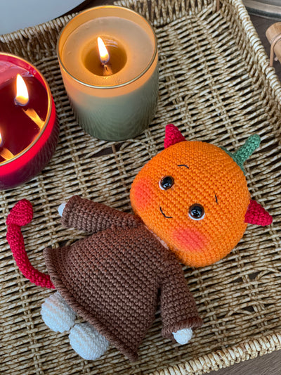 Handmade crocheted amigurumi toy named Pumpkin Monster Devil with a cute pumpkin head, devil horns, and a custom name option. Perfect for Halloween or spooky-themed gifts.