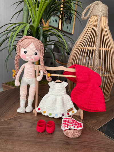 Handmade crochet Little Red Riding Hood doll, inspired by the classic fairytale, featuring a red cape, basket, and customizable name on a leather label. Perfect for kids and collectors.