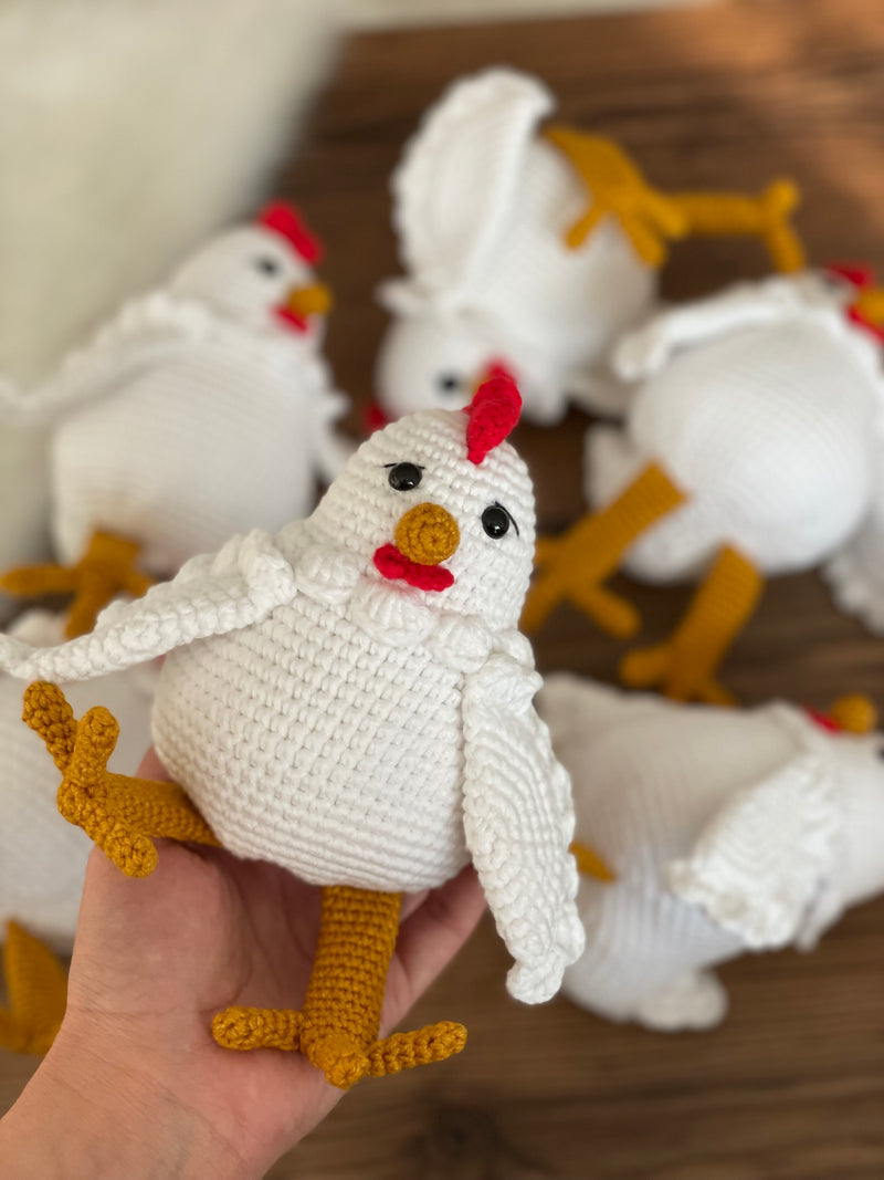 Handmade crocheted Chicken Toys with a cute and detailed design, featuring a red comb and yellow feet. This amigurumi toy is customizable with a name on a leather label, making it a perfect farm-themed nursery decor and personalized gift.