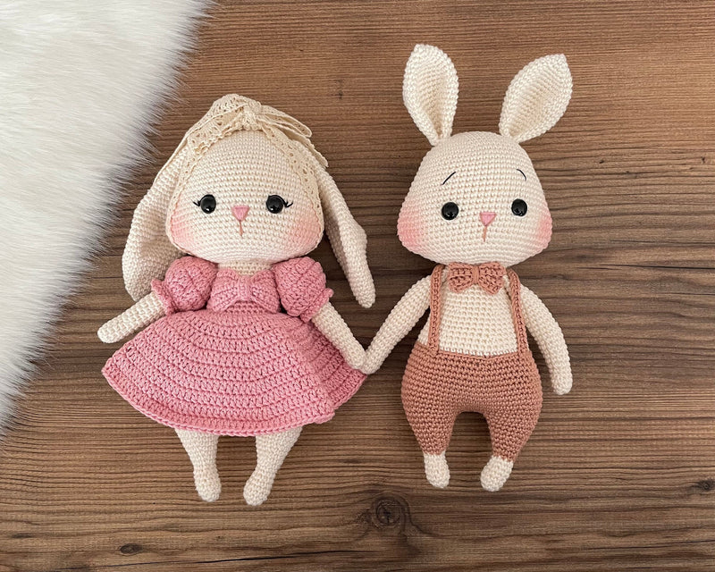 Handmade pink and brown bunny rabbit couple toy, crocheted with amigurumi technique, personalized with names on leather labels, perfect for gifts and decor.