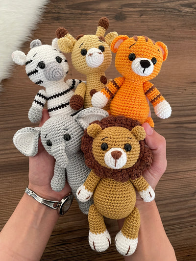 Handmade Safari Animals set including giraffe, tiger, elephant, zebra, and lion, all made with 100% cotton yarn, perfect for unique toddler gifts and imaginative play.