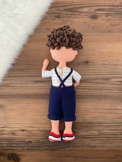 Handmade crocheted overall boy doll, crafted with amigurumi technique using 100% cotton yarn, customized with a name on a leather label, perfect gift.