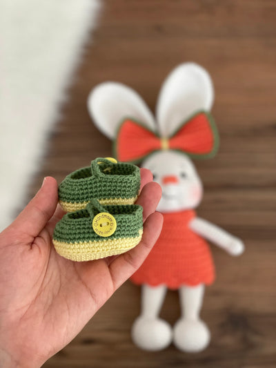 Handmade crocheted Orange Fancy Bunny Rabbit Toy in a bright orange dress with a large bow, customizable with a name on a leather label. Made using amigurumi techniques, this cute bunny is perfect for kids, nursery decor, or as a personalized gift.