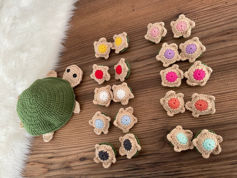 Handmade crochet turtle matching colors toy and memory game set. Includes a large turtle and small color-matching pieces for educational play. Customizable with a name on a leather label.