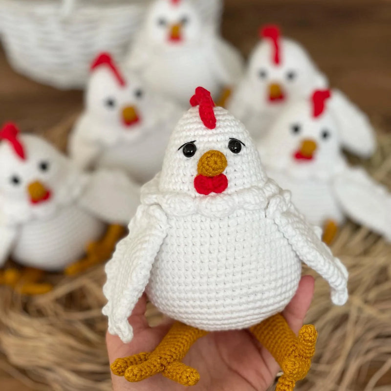 Handmade crocheted Chicken Toys with a cute and detailed design, featuring a red comb and yellow feet. This amigurumi toy is customizable with a name on a leather label, making it a perfect farm-themed nursery decor and personalized gift.